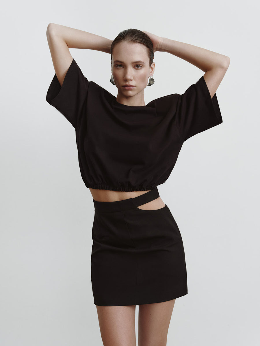 Mini skirt with a decorative neckline